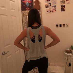 Grey workout shirt very flowy with cut out sides